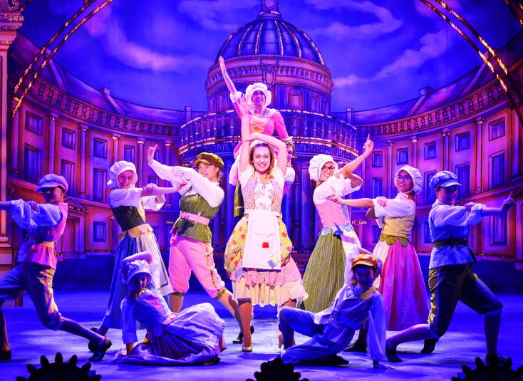 Panto cast dance on stage